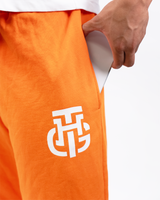 THG ORANGE CROPPED SWEATPANTS