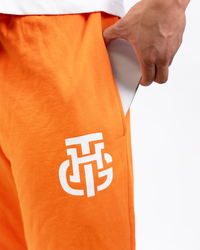 THG ORANGE CROPPED SWEATPANTS