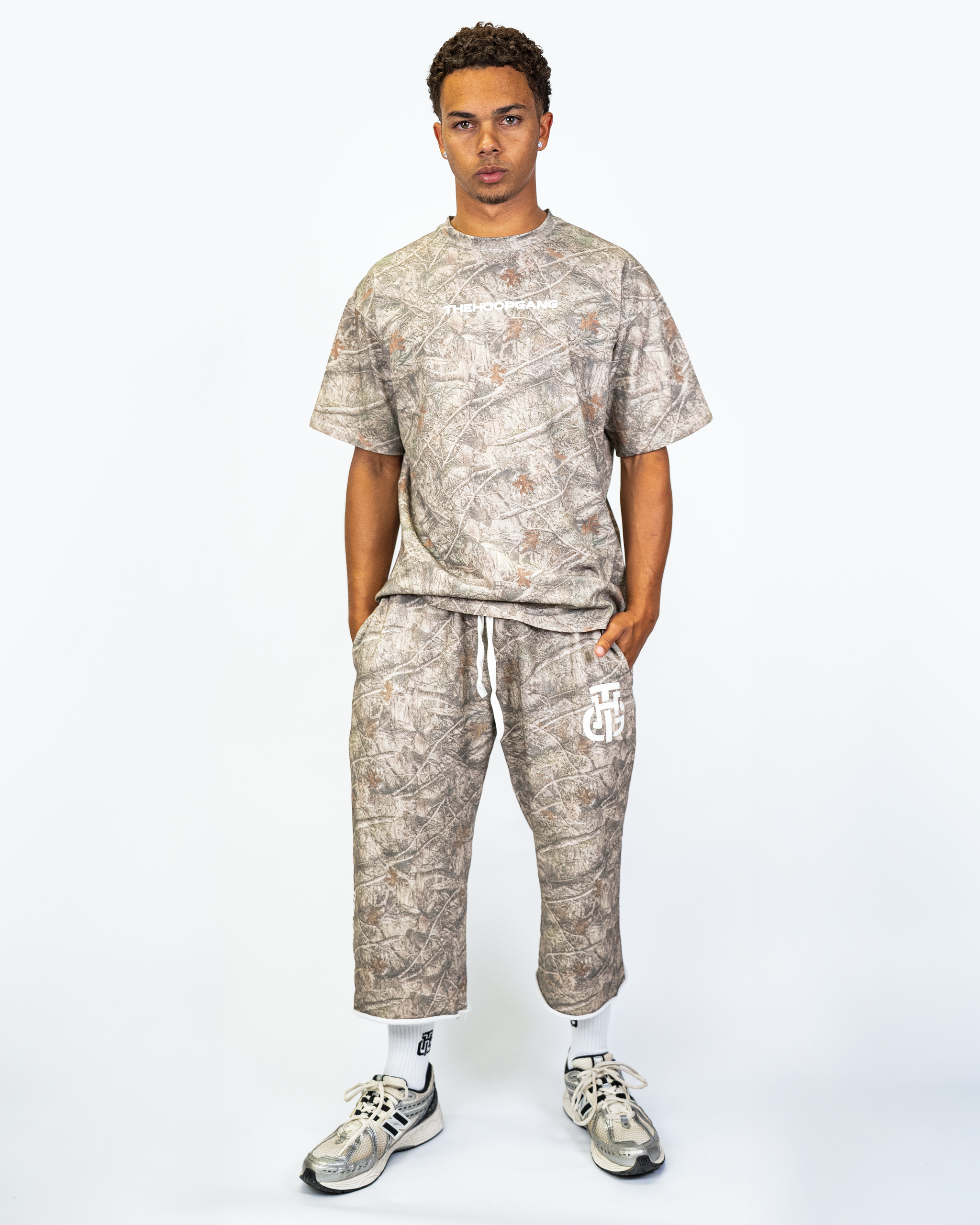 Model wearing THG Camo Cropped Sweatpants