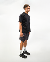 Dark Camo Shorts on model, three-quarter view