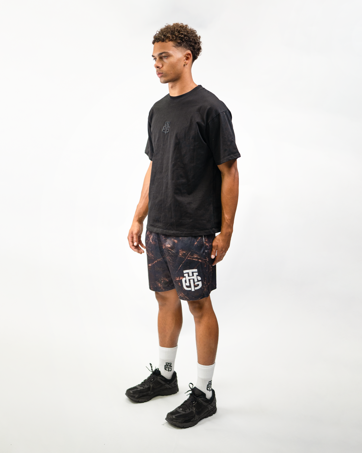 Dark Camo Shorts on model, side view