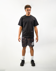 Dark Camo Shorts on model, front view