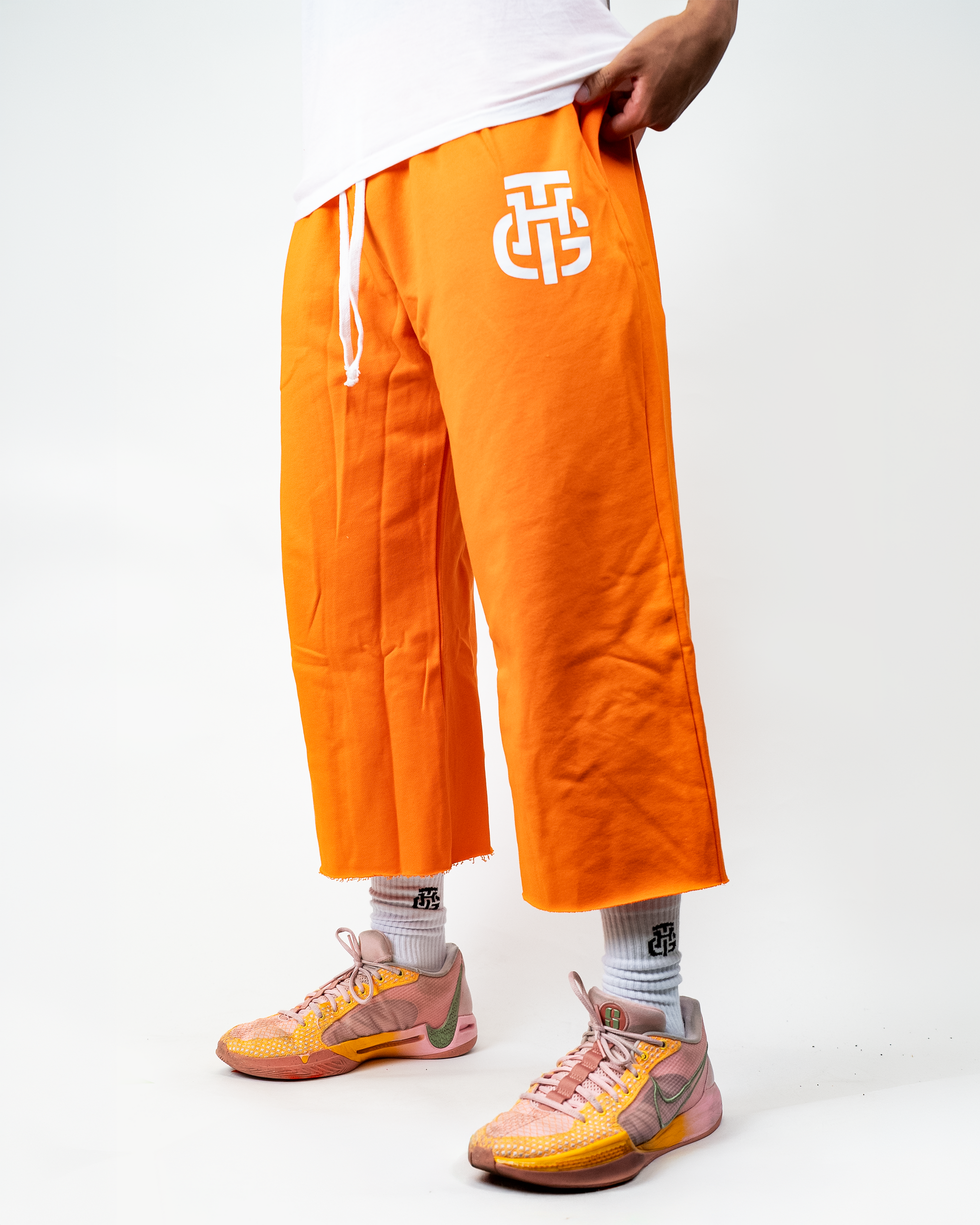 THG ORANGE CROPPED SWEATPANTS