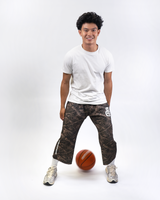 Model wearing THG Dark Camo Cropped Sweatpants